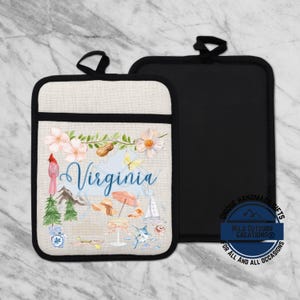 May include: A set of two pot holders. One pot holder features a Virginia-themed design with a cardinal, flowers, and the word "Virginia" in script. The other pot holder is solid black. The pot holders have a black trim and a loop for hanging.