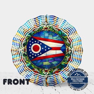 May include: A decorative wind spinner featuring the Ohio state flag design. The central emblem is a circular stained-glass effect with the state flag. The outer edges have a striped pattern in blue, white, and yellow. The text "FRONT" is visible at the bottom.