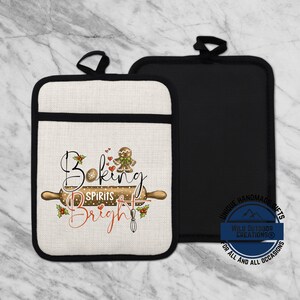 May include: Two rectangular oven mitts, one beige with a black border and one solid black. The beige mitt features a gingerbread man, a rolling pin, and the text Baking Spirits Bright in black and red script, accented with holly berries.