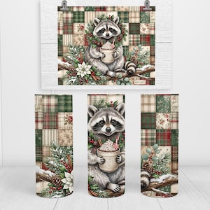 May include: A cylindrical tumbler featuring a raccoon holding a mug of hot cocoa with whipped cream, surrounded by pine branches, berries, and poinsettias. The background consists of a red, green, and beige plaid patchwork pattern design.