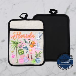 May include: A set of two pot holders. One pot holder features a Florida-themed design with a flamingo, palm tree, and the word "Florida" in orange script. The other pot holder is solid black. The pot holders have black trim and a loop for hanging.