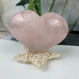 A natural rose quartz heart is a heart-shaped crystal made of rose quartz that is found in nature.