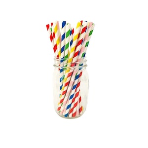 May include: A glass jar filled with colorful striped paper straws. The straws are red, blue, yellow, and pink.