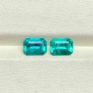 Zambian Bluish Green Emerald Pair: 1.93 Carat, 7x5mm Emerald Cut Gemstones