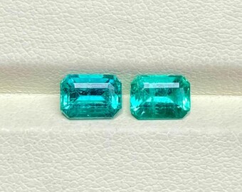 Zambian Bluish Green Emerald Pair: 1.93 Carat, 7x5mm Emerald Cut Gemstones