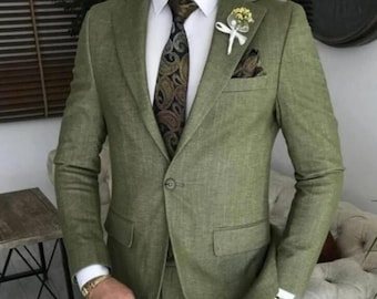 May include: A green suit with a patterned tie and a white pocket square. The suit is made of a textured fabric.