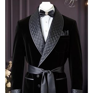 May include: A black velvet tuxedo jacket with a shawl collar and a satin lapel. The jacket has a quilted lining and a matching satin belt.