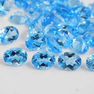 Topaze bleu suisse naturelle ovale taillée à facettes Taille des pierres précieuses en vrac 4x6mm 5x7mm, 6x8mm, 7x9mm 8x10mm 9x11mm pierres précieuses calibrées Fabrication de bijoux