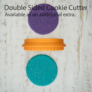 May include: Double-sided cookie cutter with a purple and teal design. The cutter is available as an additional extra.