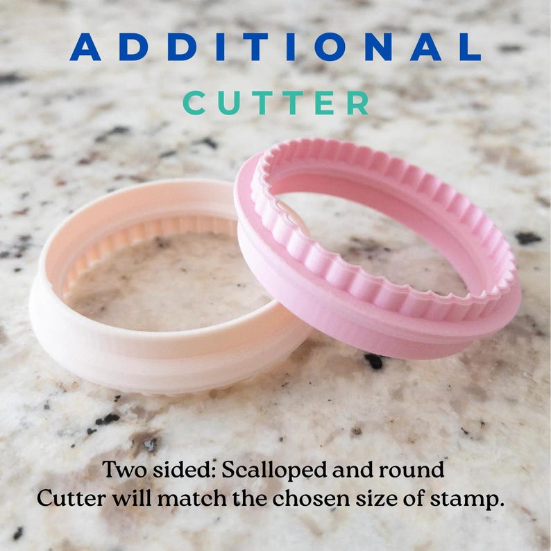 May include: Two pink plastic cookie cutters, one with a scalloped edge and one with a smooth round edge. The text "ADDITIONAL CUTTER" is above the cutters. The text "Two sided: Scalloped and round Cutter will match the chosen size of stamp." is below the cutters.