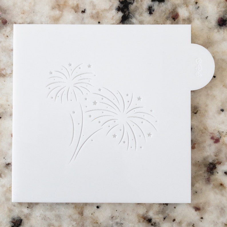 May include: White plastic stencil with a design of two fireworks with stars.