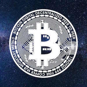 May include: White Bitcoin coin illustration with the Bitcoin symbol in the center, set against a starry night sky background. The coin's edge features text including "Bitcoin Digital Decentralized Peer to Peer" and "Monetary Metals".