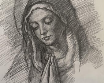 May include: A graphite pencil drawing on paper depicting a figure with eyes closed and hands pressed together in a prayer position. The figure wears a draped head covering with soft shading and cross-hatching lines creating a circular halo effect.
