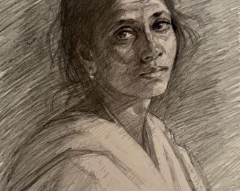 May include: A graphite pencil drawing of a person with dark hair, captured in a three-quarter view. The portrait features detailed shading on the face, expressive eyes, and a draped garment over the shoulders, set against a textured, hatched background.
