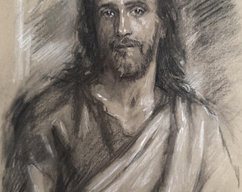 May include: A charcoal and white chalk drawing on tan paper depicting a portrait of a person with long dark hair and a beard. The figure is shown from the chest up, wearing draped fabric over the shoulders, with expressive shading and highlights.