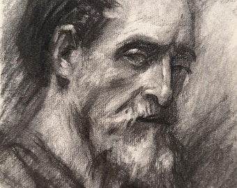 May include: A charcoal drawing of an older person with a receding hairline and a full, textured beard. The portrait is rendered in shades of black, gray, and white, capturing the facial features in profile with visible pencil strokes and shading.