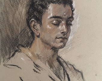 May include: A charcoal and pastel drawing on tan paper depicting a person with eyes closed and hair in a topknot. The figure wears a light-colored garment and has a small white mark on the forehead, rendered with expressive shading and highlights.