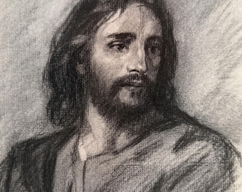 May include: A charcoal drawing on paper depicting a portrait of a person with long hair and a beard. The subject is shown from the chest up, wearing a simple garment with a V-neckline. The shading is rendered in soft black and gray tones.
