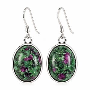 May include: A pair of oval-shaped drop earrings featuring polished green and magenta zoisite stones set in smooth silver-toned metal frames. Each earring hangs from a simple silver-toned hook wire, showcasing the natural mottled texture of the stone.