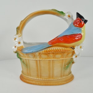 German Ceramic Bird On Basket Figurine Planter Pot Vase Beige Tan Handle Basket With White Flowers Blue Red And Yellow Bird Signed Germany