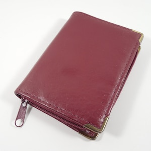Cartera para tarjetas de visita de piel granate granate con cierre de cremallera, esquinas de metal dorado, 16 inserciones de plástico de doble cara