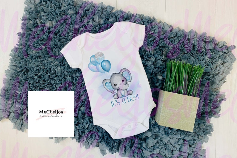 May include: White baby onesie with a watercolor design of a blue elephant holding balloons and the text "It's a boy!"