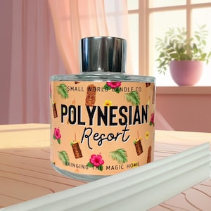 May include: A glass candle jar with a silver lid. The label features the words "Polynesian Resort" with tropical illustrations. The text "Bringing the magic home" is also on the label. The background includes a window and a potted plant.