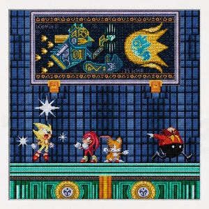 May include: A framed cross-stitch pattern featuring pixel art of Super Sonic, Knuckles, Tails, and Dr. Eggman on a blue grid background. Above them is a rectangular sign with a blue robot and a yellow sun. The text reads DETAILED CHARTS OF ANGEL ISLAND.