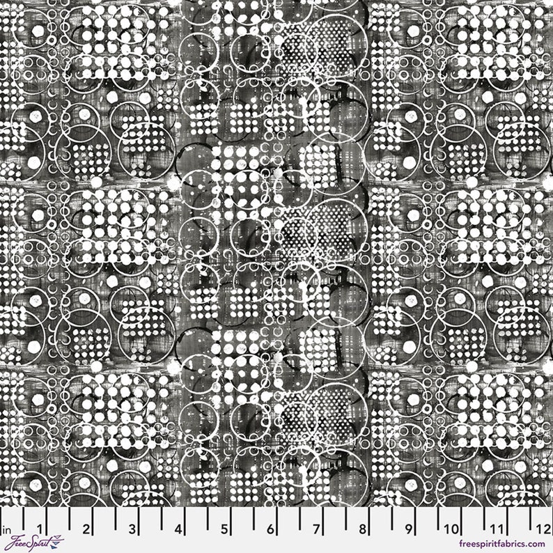 May include: Black and white patterned fabric with a repeating design of circles and dots. The design includes various sizes of white circles and dotted squares on a dark background. The fabric has a textured appearance and a ruler is shown along the bottom.