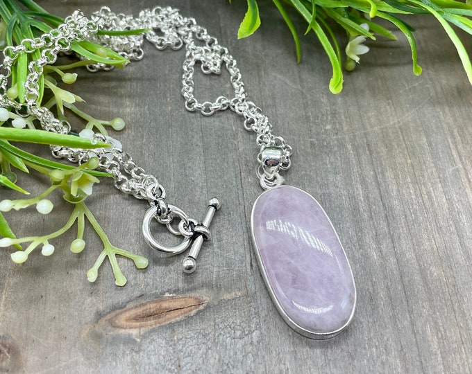 Kunzite Oval Cabochon Focal Stone Pendant | Set in sterling silver with 26 inch silver plated rolo chain and toggle clasp