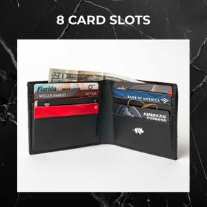 The image displays an open black leather wallet with eight card slots filled with various cards, including credit cards and a driver's license. The wallet also has a bill compartment holding cash.