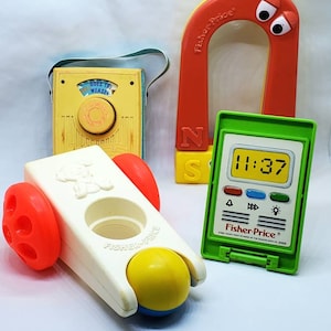Vintage Fisher Price Baby Toys Lot Of 4 Pocket Radio Magnet Click N Clatter etc.