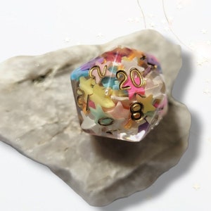 Multicoloured Stars D20 Dice DND Dungeons and Dragons Tabletop Games RPG Purple Blue Pink TTRPG Pastel Muted Transparent Cute Kids Kawaii
