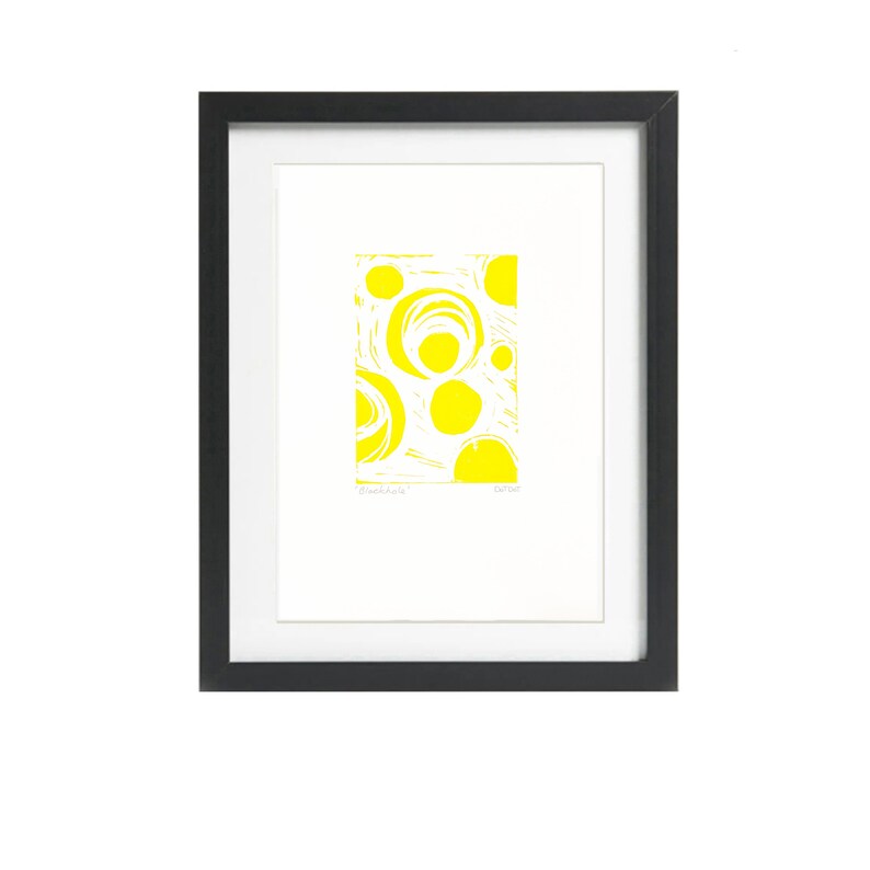 Blackhole lino print in yeloow