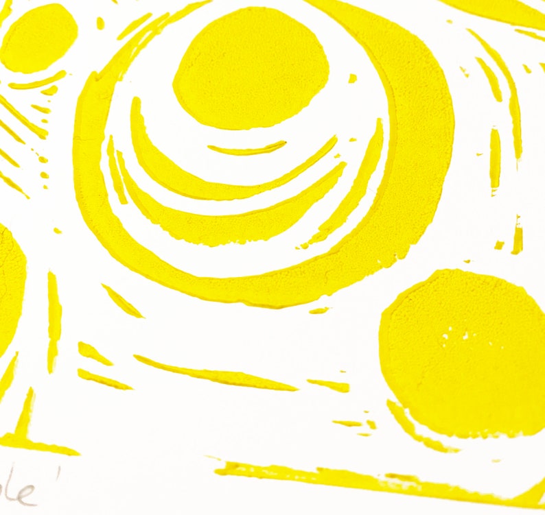 Blackhole lino print in yeloow