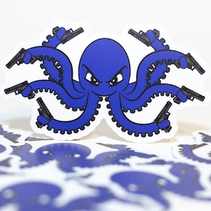 May include: Blue octopus sticker with eight arms holding guns. The octopus has a menacing expression. The sticker is on a white background.