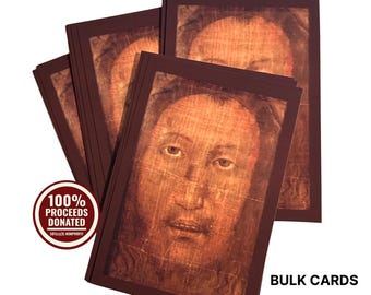May include: A stack of rectangular cards featuring a sepia-toned portrait of a face with a textured, woven appearance. A circular red badge on the left reads 100% PROCEEDS DONATED, and the text BULK CARDS is printed in black on the lower right side.