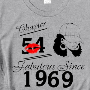 May include: Gray t-shirt with black text that reads "Chapter 54 Fabulous Since 1969". The number 54 has a red lip print over it. A black and white illustration of a woman wearing a baseball cap is to the right of the text.