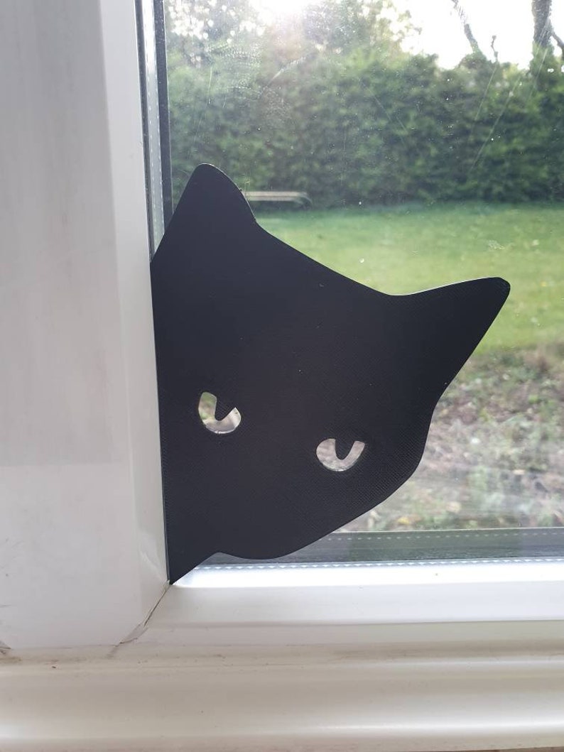 Cat Peeking Silhouette image 1