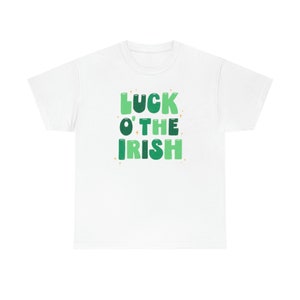 May include: White t-shirt with green and white text that reads "LUCK O' THE IRISH".