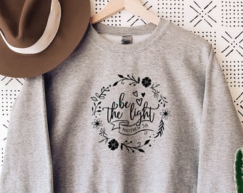 be the light crewneck