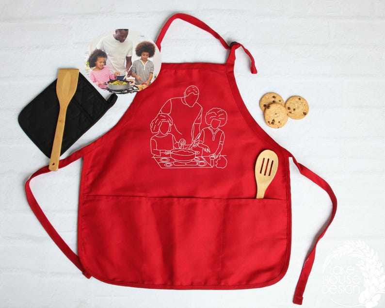 a red apron with a picture of two people cooking