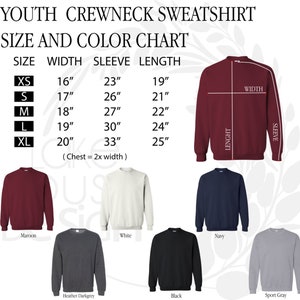 May include: Youth crewneck sweatshirt size and color chart. The chart shows sizes XS through XL with corresponding width, sleeve, and length measurements in inches. The chart also shows eight different color options for the sweatshirt: maroon, white, navy, heather dark grey, black, and sport grey.