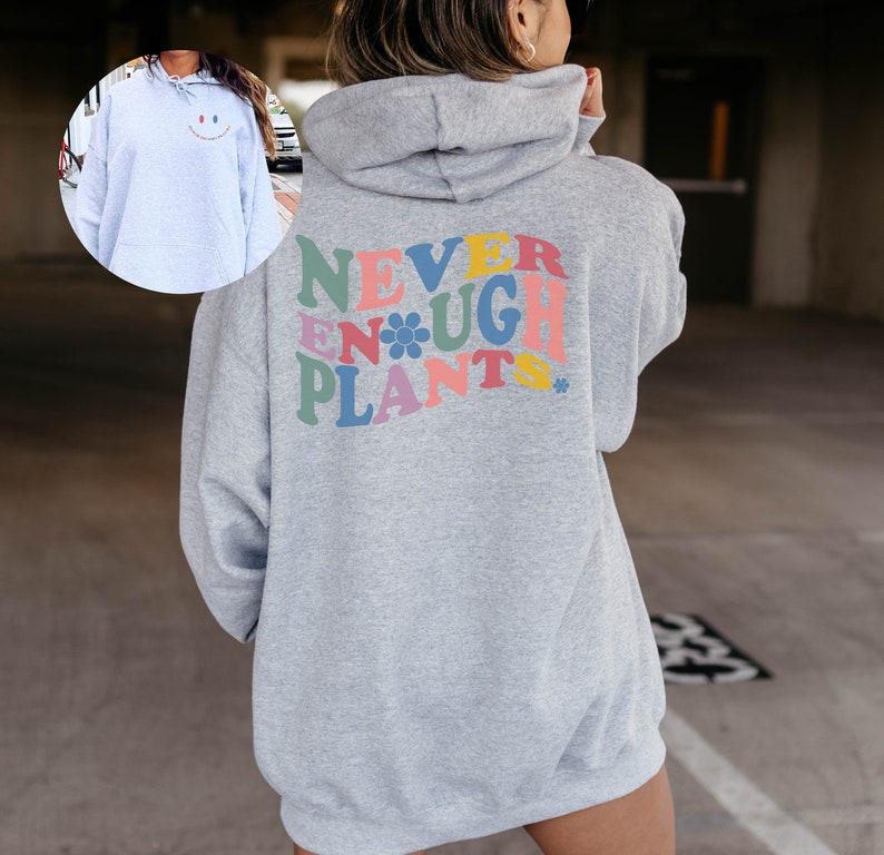 May include: Gray hooded sweatshirt with the text "NEVER ENOUGH PLANTS" in colorful letters on the back.