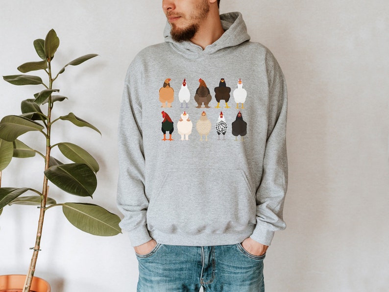 May include: A gray hooded sweatshirt with a print of various chickens in different colors and poses.