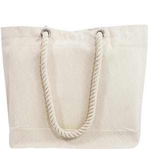 A beige canvas tote bag with a rope handle.