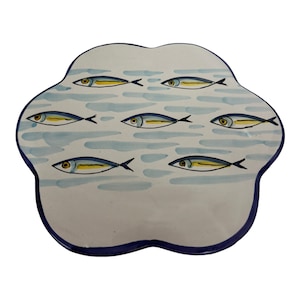 May include: A white ceramic serving platter with a blue rim and a design of yellow and blue fish swimming in blue water.