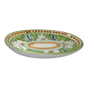 May include: An oval ceramic serving platter with a green background and a white, orange, and brown floral design. The platter has a raised rim and a smooth, glossy finish.