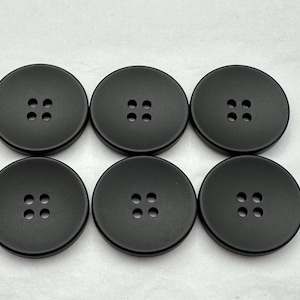 Black buttons 28mm sew through smooth matt finish sold as a set of six buttons