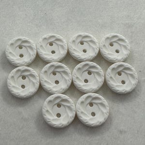 White buttons 15mm a set of 10 with a matt sculpted effect